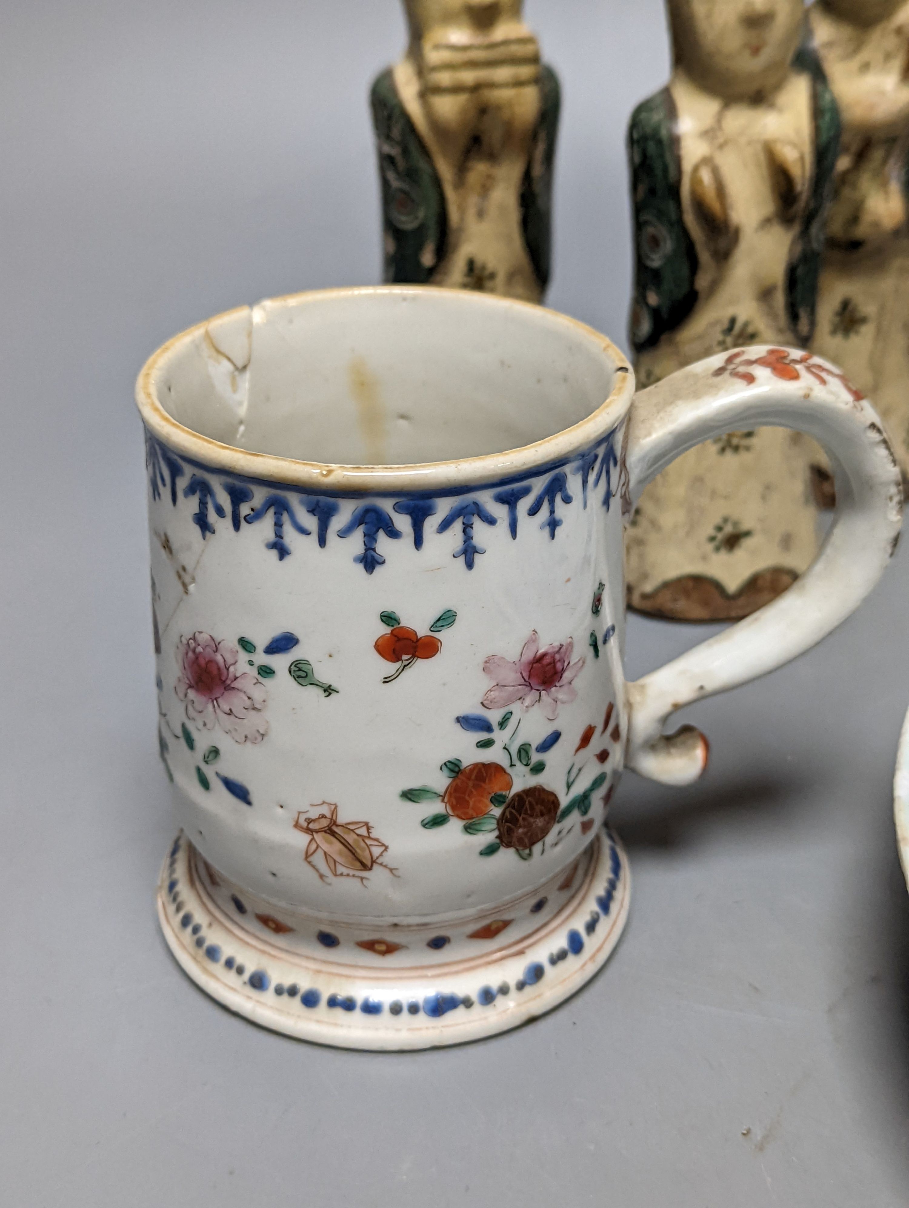 Six Chinese pottery figures and a mug and two plates, largest plate 24 cms diameter.